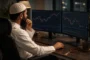 Muslim trader at desk researching which types of trading are halal or haram in Islam